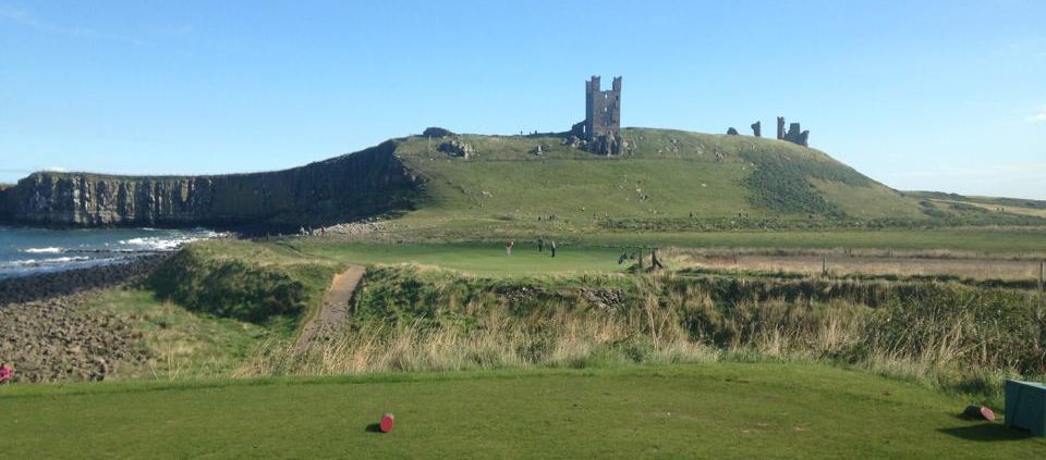 On the tee with a castle in the background