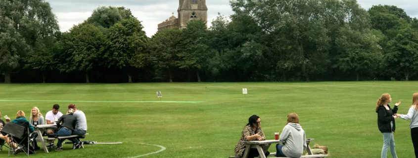 Tables on the field in front of the church